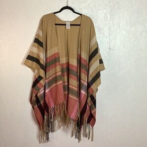 Tan Woolrich shawl with red,whiteand black plaid detail and fringe along bottom
